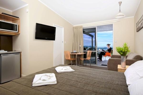 A Top Motel room at Waihi Beach features a secluded balcony with stunning sea view.